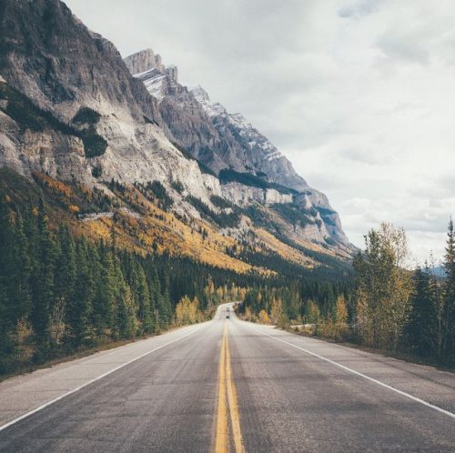 country-road-along-rocky-mountains-royalty-free-image-678834219-1550781633
